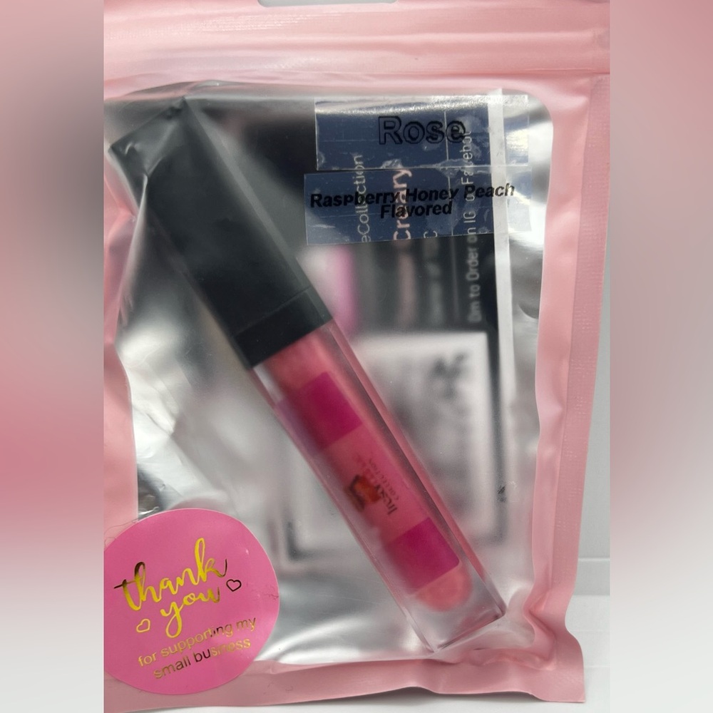 Customized Flavored Lip gloss that has a light and mirror on the tube